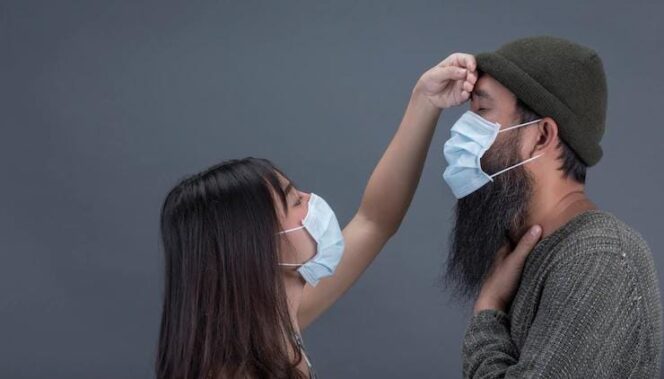 
					Ilustrasi pencegahan penularan virus dengan menggunakan masker.